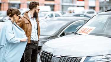 Couple buying a car